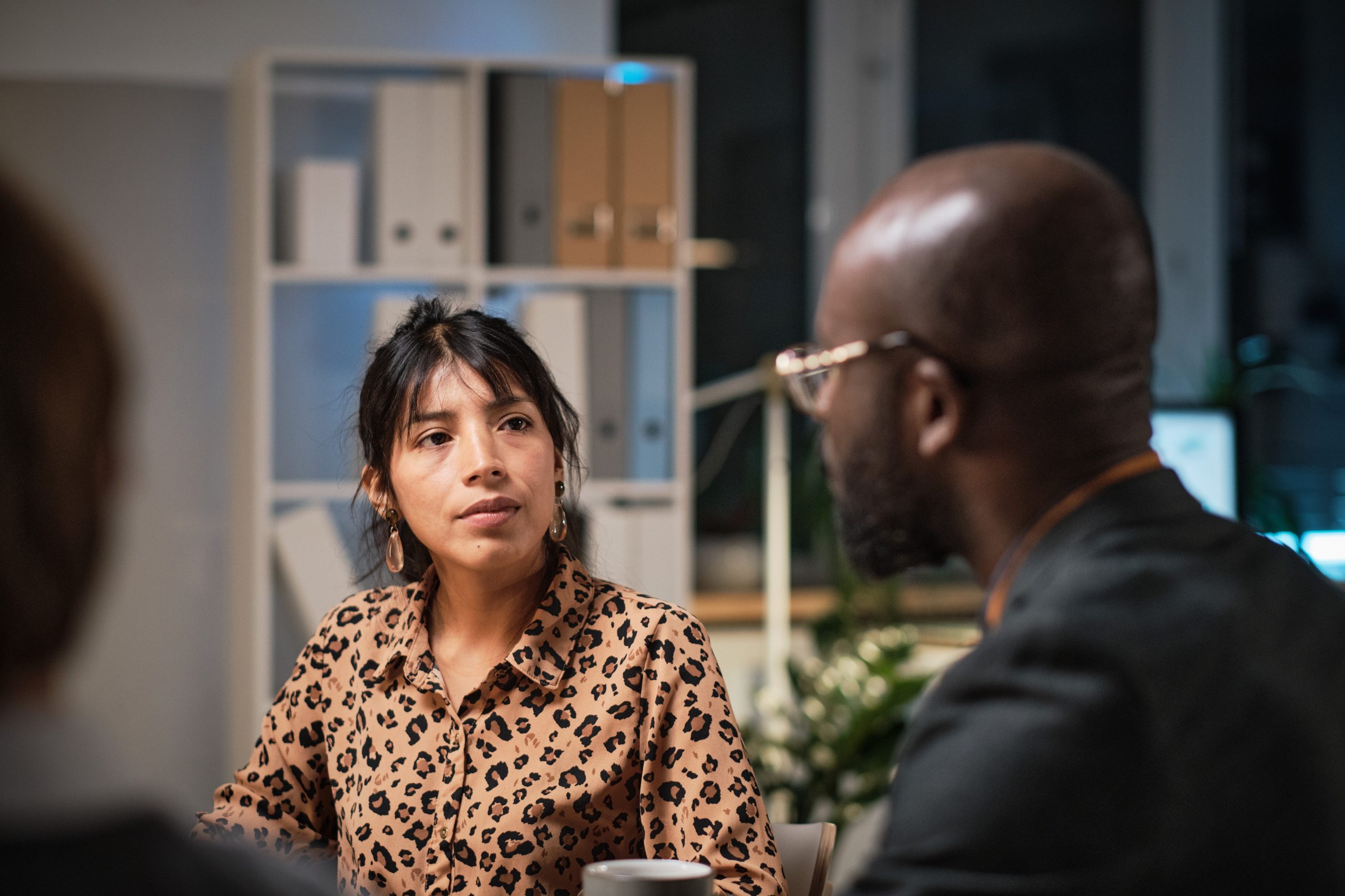 Businesswoman talking to colleagues at meeting